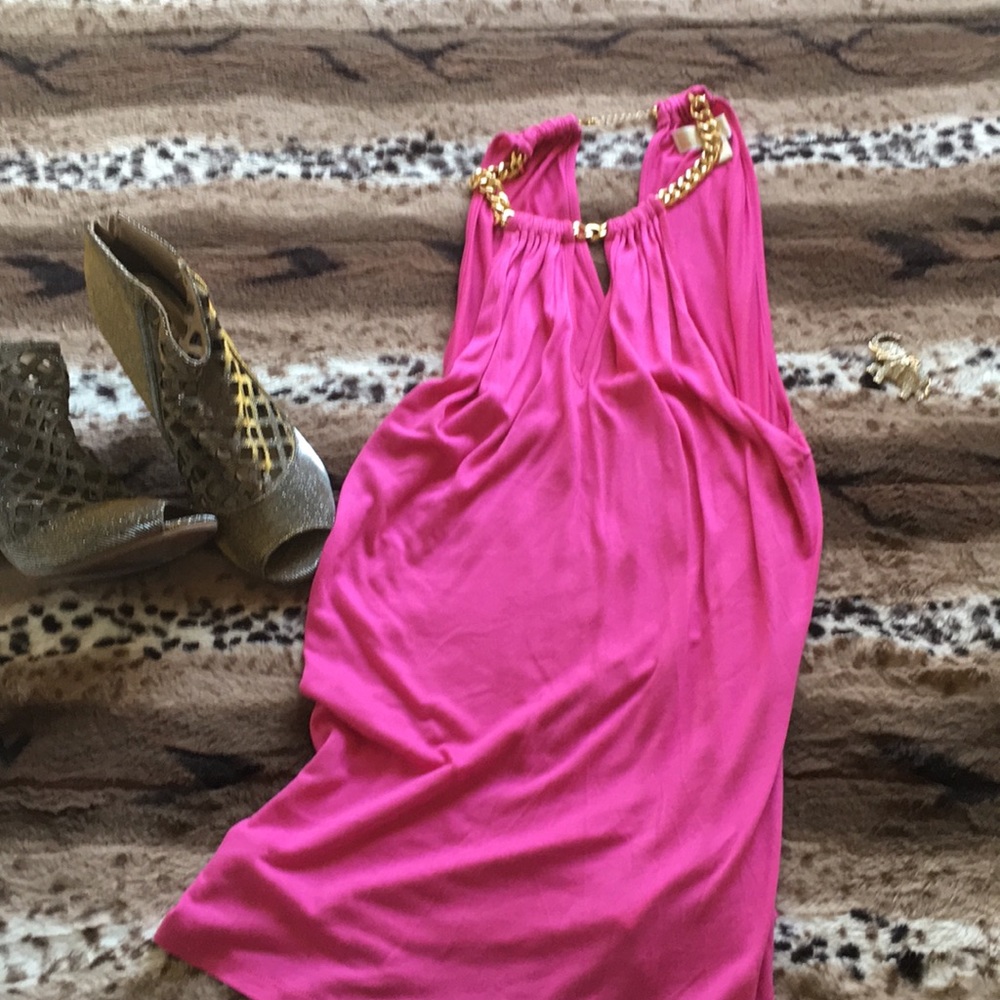 Pink top, gold chain on neck